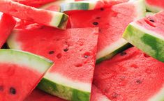 slices of watermelon are arranged on a plate