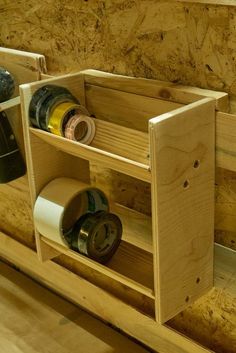 a wooden shelf filled with lots of bottles