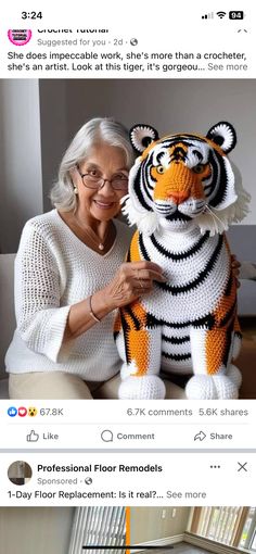 an older woman is holding a stuffed tiger