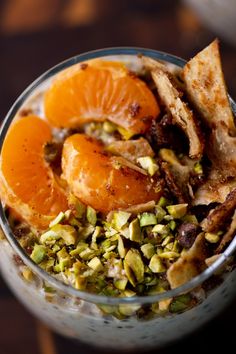 an orange and pistachio dessert in a glass bowl