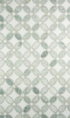 a white and blue tile with circles on it's surface is seen in this image