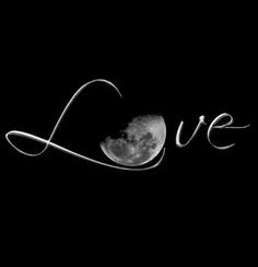 the word love written in white ink on a black background with a full moon behind it