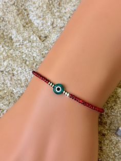 These evil eye bracelets are handmade-to-order just for you! 🧿 Evil eye jewelry dates as far back as 3000 BC. Many ancient cultures wore amulets or jewelry with the evil eye symbol to protect them. Today the evil eye brings good luck and good vibes. An evil eye in turquoise also represents success, peace and health! Each one is made-to-order and features a handmade lampwork evil eye bead surrounded by Hematite beads. Hematite is known for it's grounding properties. Because each Evil Eye bead is Beaded Evil Eye, Red And Turquoise, Eye Bracelets, Red Beaded Bracelet, Bracelet Evil Eye, Greek Evil Eye, Eye Symbol, Protection Bracelet, Hematite Beads