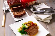 two plates with meatloaf, broccoli and mashed potatoes