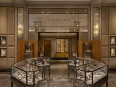 the inside of a jewelry store with glass cases