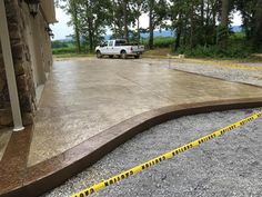 a white truck parked in front of a house with yellow caution tape on the ground