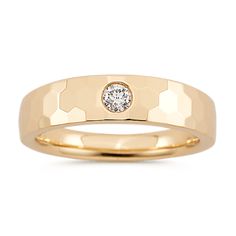 a gold ring with a diamond in the center