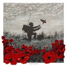 a man kneeling down in a field with red flowers and a bird flying over him