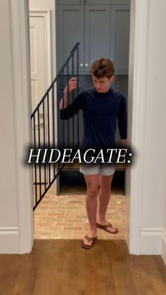 a young boy standing in front of a door with his hand on his hip and the words hidegate above him