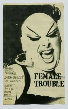 a poster with an image of a woman's face and words that read female trouble