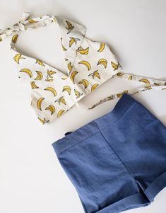 "Girls crop Banana Print Halter Top, 70s inspired girls shirt, boho beach outfit ❤Listing is for the top only This halter top is made in an off-white cotton poplin featuring yellow bananas outlined in black. 1970s inspired! Pair it with flares or high waisted shorts to get that cute 70s look ❤Complete the outfit with matching highwaisted shorts, available here: https://www.etsy.com/shop/CeciliaAndMae?ref=simple-shop-header-name&listing_id=654125713&section_id=26035288 Size chart: 3T Ches Triangle Top For Summer Day Out, Summer Beachwear Tops With Halter Neck, Summer Halter Neck Beachwear Top, Fitted Tops For Summer Beach Party, Summer Vacation Halter Neck Top, Summer Poolside Halter Neck Top, Halter Neck Top For Poolside Summer, Halter Neck Tops For Poolside Summer, Beach Season Crop Top For Poolside