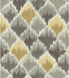 an upholstered fabric with yellow and grey colors