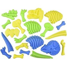 a bunch of plastic toys that are in the shape of fish bones and alligators