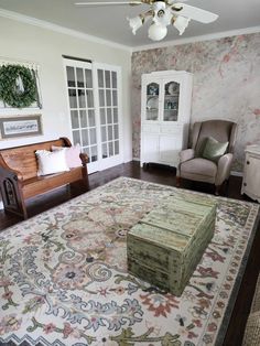 a living room filled with furniture and a rug