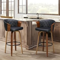 two black leather bar stools in a kitchen