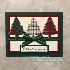 a christmas card with three trees and ribbon on the front, decorated in plaid fabric