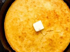 a skillet with some food in it on the stove top, ready to be cooked