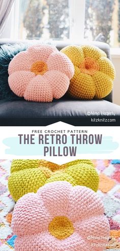 two crocheted flower pillows sitting on top of a couch next to a window