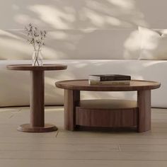 two wooden tables sitting on top of a hard wood floor