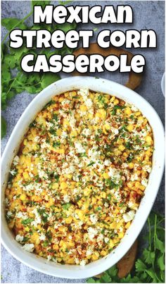 mexican street corn casserole in a white dish with parsley on the side