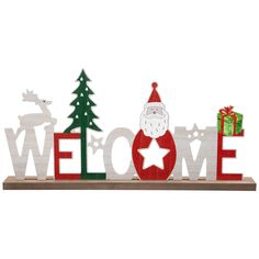 a wooden welcome sign with santa clause and christmas trees on it's sides, in front of a white background