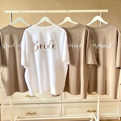 three bride t - shirts hanging on a rack