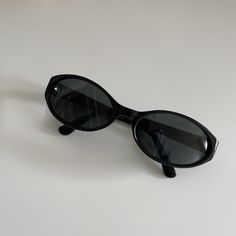 These round oval sunglasses are your everyday classic. Featuring a black frame with black smoke lens. This style is unisex. True genuine vintage sunglasses from the 90s.  - 400 uv  - new vintage from the 90s - includes sunglasses pouch  Measurements: Lens width 58mm Lens height 34mm Frame width 133mm Bridge 17mm Arm temple 130mm Available in other colors Red tortoise https://etsy.me/3mgHuDR Amber red https://etsy.me/3FIQCZU Trendy Oval Sunglasses, Amber Sunglasses, Black Oval Sunglasses, 90s Sunglasses, Sunglasses Pouch, Y2k Sunglasses, Chic Sunglasses, Style Upgrade, Oval Sunglasses