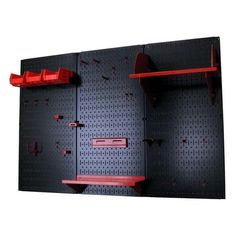 there are two red shelves on the pegboard and one is black with red handles