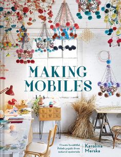 the cover of making mobiles, with colorful beads hanging from it's ceiling