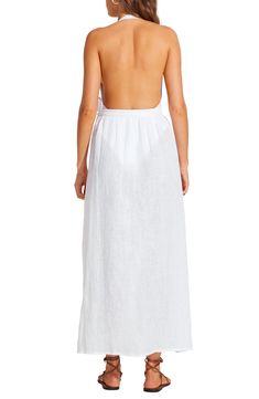 You'll feel like a vintage starlet when you're walking along the beach in this linen wrap skirt that has an open side that dramatically catches the breeze. True wrap style with side tie closure Unlined 100% linen Hand wash, dry flat Imported Linen Long Skirt For Vacation, Long Linen Skirt For Vacation, Summer Long Wrap Skirt For The Beach, Summer Long Wrap Skirt For Beach, Linen Skirt For Vacation, Beach Maxi Skirt With Side Slits For Spring, Chic Beach Skirt With Side Slits, Spring Beach Maxi Skirt With Side Slits, Linen Maxi Skirt For Summer Beach