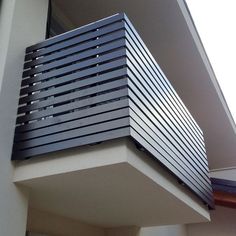 a close up of a balcony railing on a building