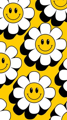 a yellow and black pattern with white flowers on it's sides, smiling faces in the center