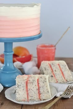 two slices of cake sitting on plates next to each other with fruit in the background