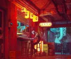 a man sitting at a bar in the middle of a room with neon lights hanging from the ceiling