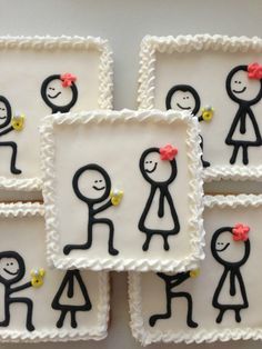 a group of small cakes with stick figures on them