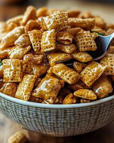 a bowl filled with cheetos sitting on top of a wooden table