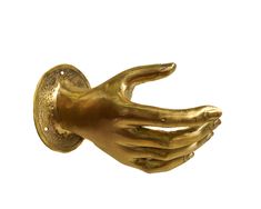 a gold colored hand that is holding something