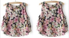 two tops with flowers on them hanging from clothes hangers, one in pink and the other in black