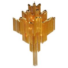 an art deco chandelier with gold fringes hanging from it's sides