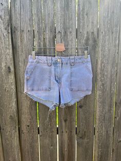 These cut off jean shorts are amazing and will look great all summer. They have some reddish color to them, most likely from color bleeding during a wash. They still look amazing and have a more unique look. They are in great condition and have no rips, holes or smells. Measurements: laying flat and doubled Waist: 30 inches Hips: 36 inches Rise: 9 inches Inseam: 4 inches Length: 10 inches Size on tag: 8 (check measurements for best fit) Y2k Style Short Jeans For Summer, Y2k Style Short Summer Jeans, Y2k Jean Shorts With Built-in Shorts For Summer, Y2k Jean Shorts For Summer, Y2k Style Short Jean Shorts For Summer, Y2k Style Jean Shorts For Summer, Summer Y2k Jean Shorts, Dark Wash Cutoff Summer Shorts, Y2k Style Cutoff Cotton Jeans