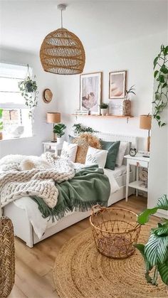 a bedroom with white walls and wooden flooring, wicker baskets on the bed