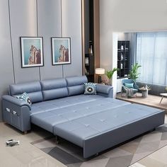 a modern living room with blue leather furniture