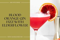 blood orange gin fizz with elderflower in a glass next to grapefruit