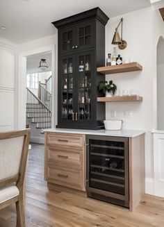 the kitchen is clean and ready to be used as a wine bar for entertaining guests