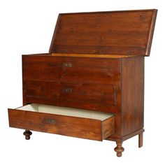 an old wooden chest with two drawers on the bottom and one open drawer below it