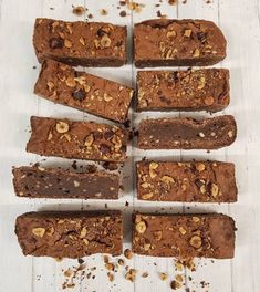 several pieces of brownie with nuts on top