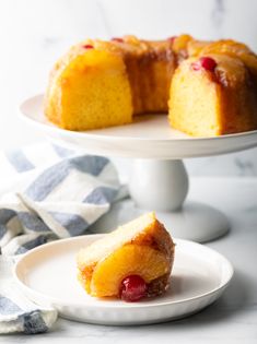 two pieces of pineapple upside down cake on plates