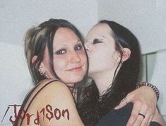 two women hugging each other with the word madison written on their arm and foreheads