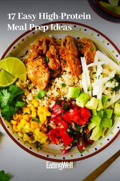 a white plate topped with chicken, rice and veggies on top of a table