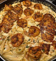 pasta with shrimp and cheese in a skillet